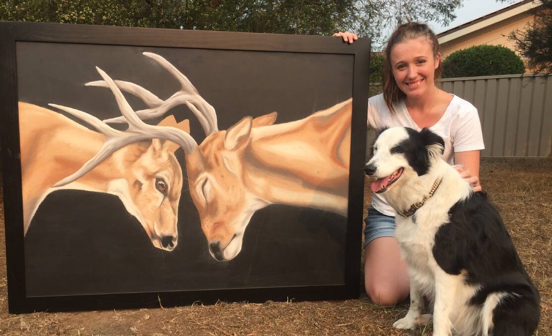 BRILLIANT: Nowra artist Eleisha Ryan with one of her stunning works. She has offered to draw loved pets or prized stock lost in the South Coast fires.