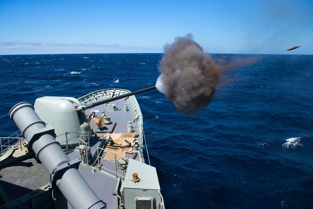 HMAS Anzac fires her five inch main gun off the coast of Jervis Bay. Photo: Paul McCallum