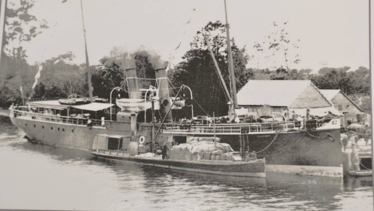 A historic photo of the Allowrie and a Riverboat at the Nowra Sailing Club building and wharf. Photo: Shoalhaven Historical Society.