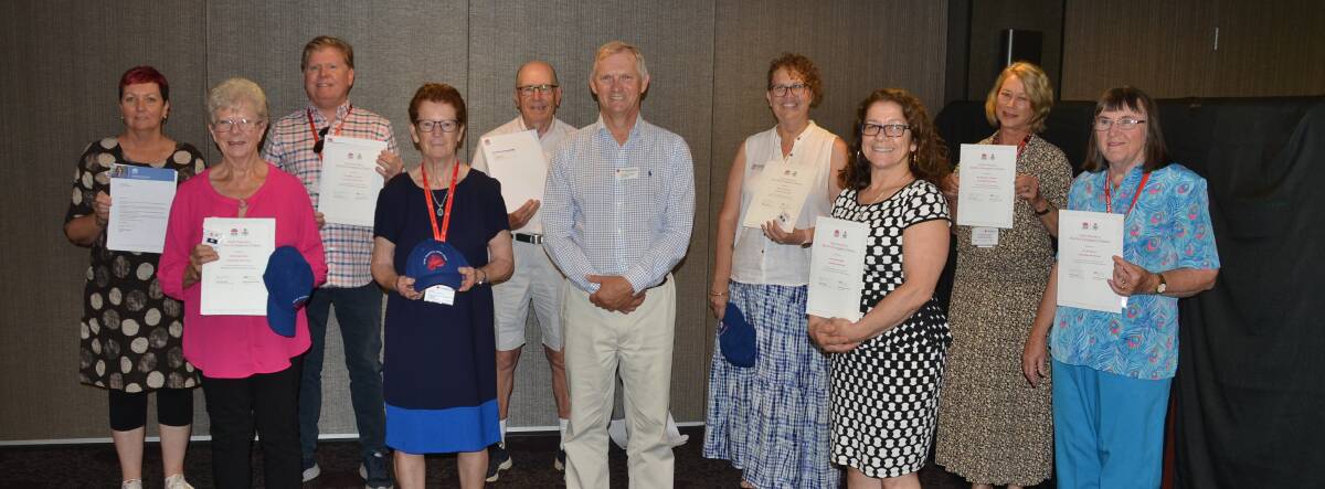 PROUD MOMENT: NSW Red Cross chairman John MacLennan (centre) with nine Shoalhaven Red Cross emergency services volunteers presented with NSW Bushfire Emergency Citations (back row from left) Alison Murie, Jeff Cockrem, Tony Simmonds, Kristy Steicke, Elizabeth Rocheta, Jan Dowd. Front row: Denise Scott, Bev Simmonds and Carol Gonella.