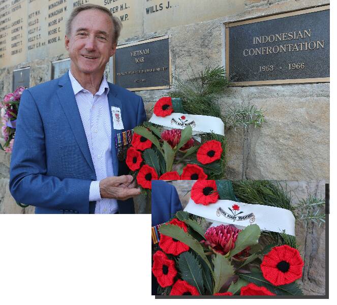 Waratah Re-Enactment Committee chairman Clyde Poulton with the wreath made by Bomaderrry man Barry Harper, in honour of the Waratahs for Nowra’s Remembrance Day commemorations.