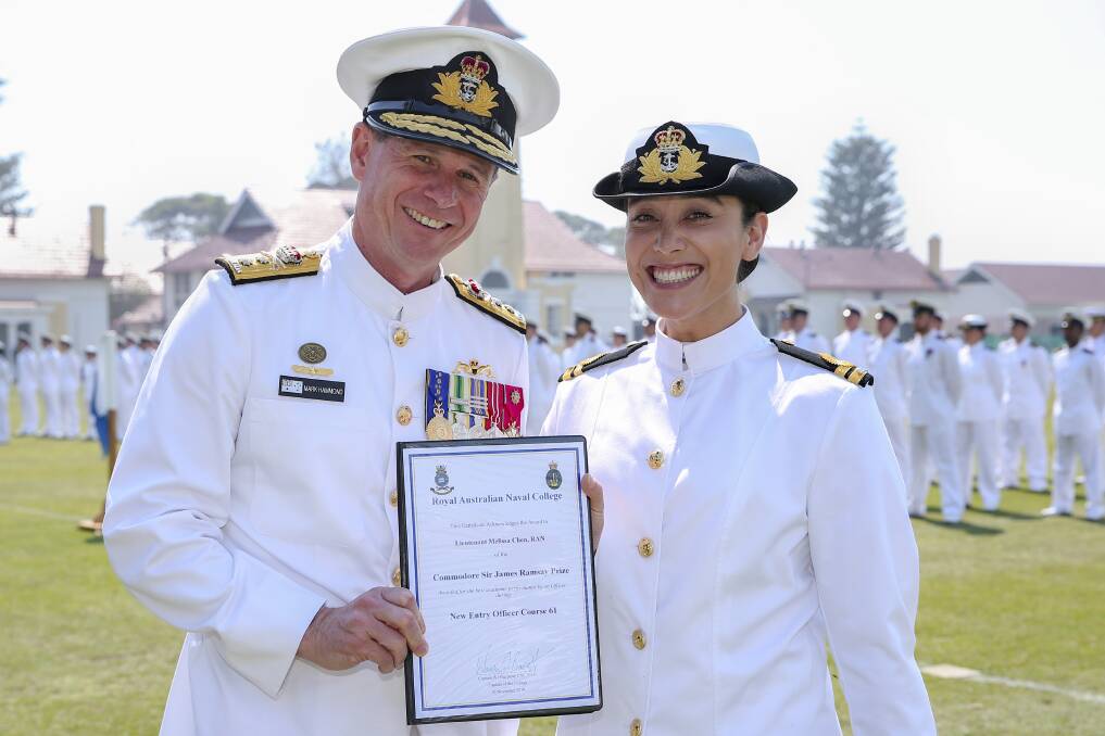 Deputy Chief of Navy, Rear Admiral Mark Hammond presents Lieutenant Melissa Chen, RAN with the Commodore Sir James Ramsay prize for best academic performance while on course. LEUT Chen also took out the Naval Historical Society prize for best researched naval history assignment and the E.S. Cunningham cup for outstanding leadership. Photo: Kel Hockey