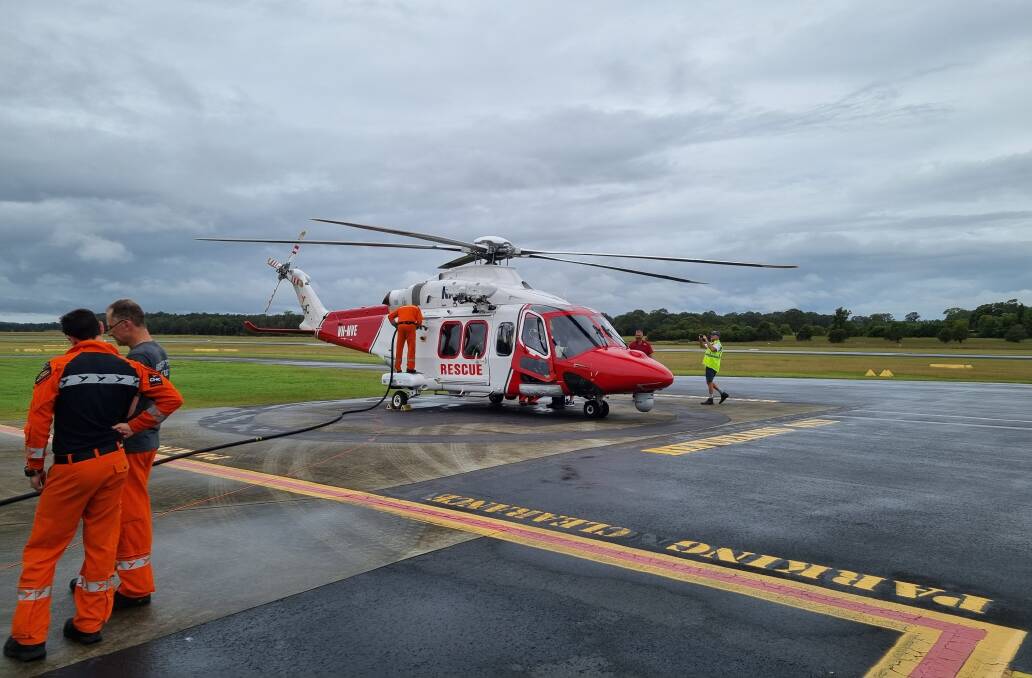 PIT STOP: CHCs Royal Australian Navy contracted search and rescue aircraft from HMAS Albatross refuelling in Taree on the way to Ballina to support any potential need over the next few days. Image: Supplied
