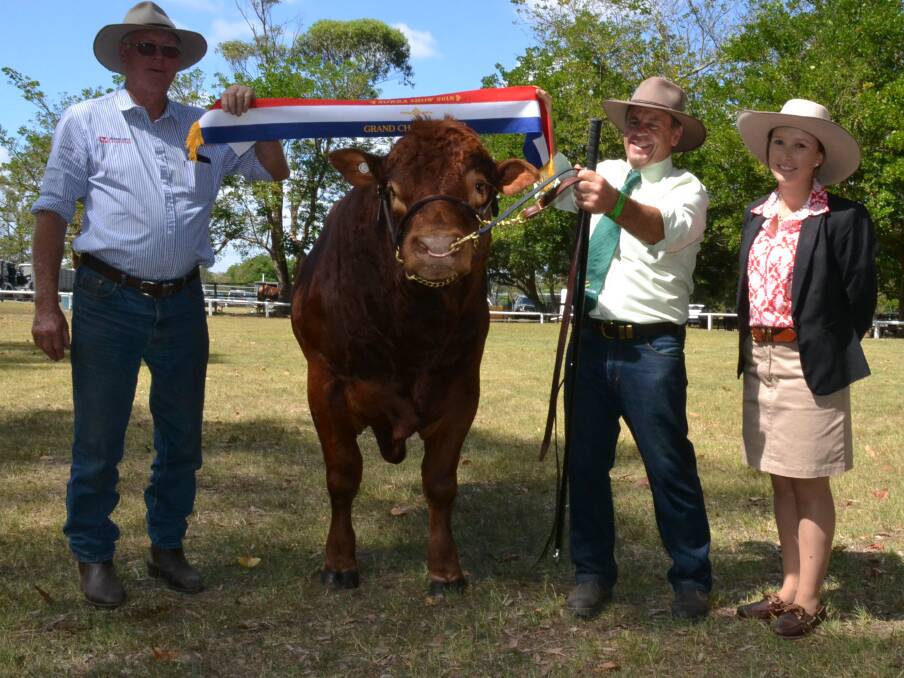 Grand champion bull was the Williams Family’s South West Tow Truck shown by Bill Williams. Phil Monaghan, of Manildra Stockfeed and judge Annika Whale make the presentation.
