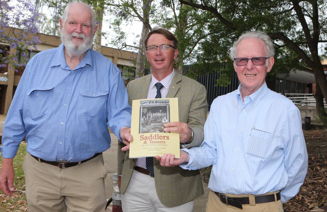 SERIES: Saddlers and Tanners of the Nowra District co-authors Peter Bindon (left) and Alan Clark (right) with John Bennett OAM who officially launched the publication at the Nowra Museum on Saturday, November 30.
