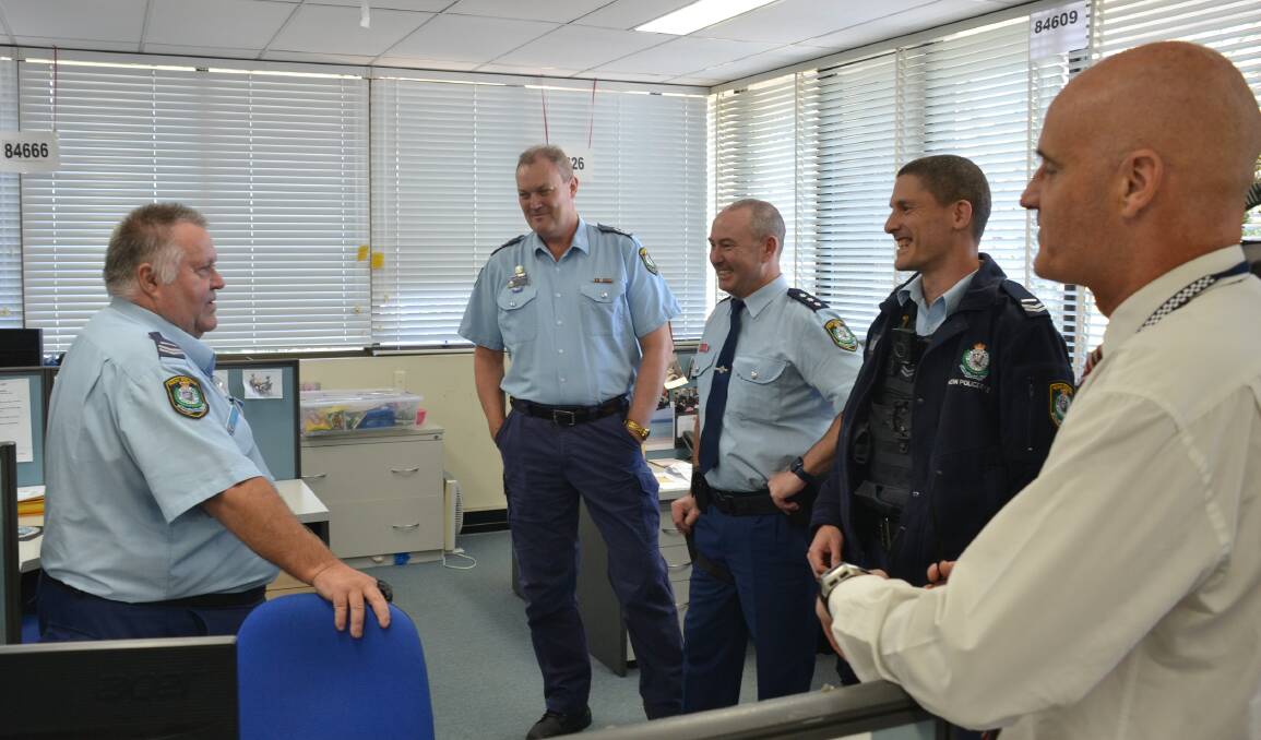 POPULAR TEAM MEMBER: Senior Constable Anthony Jory chats with fellow colleagues during his special farewell morning tea.
