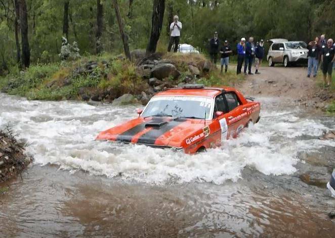 Shoalhaven trio Noel Kennedy, Al Spencer and Peter Flanagan cross a creek in Victoria in the Ford Falcon GT1. Photo: Phil Torode
