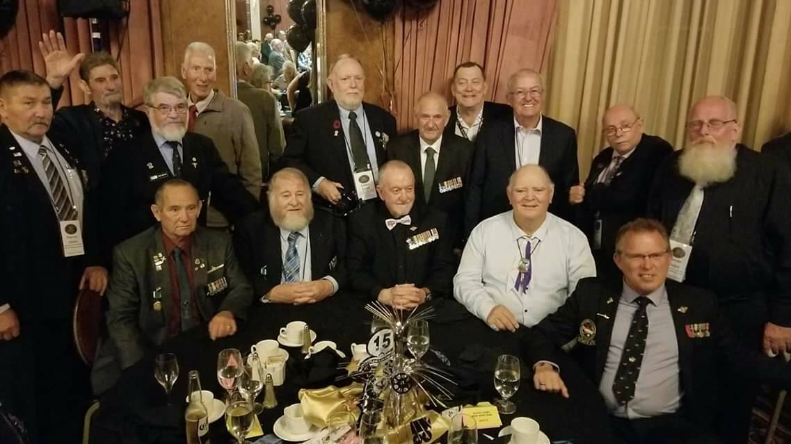 Shoalhaven men Jim Lyall and Ian "Spike" Jones (fifth and sixth back row from the left) with fellow Aussie veterans at the 50th anniversary of the tragic collision between the Australian aircraft carrier HMAS Melbourne and the US destroyer USS Frank E Evans.