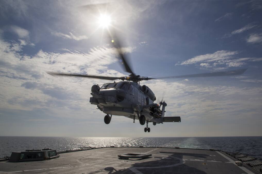 HMAS Ballarat's embarked MH-60R Seahawk helicopter takes off from the ship's flight deck in the Arabian Gulf on Operation Manitou. Bradley Darvill