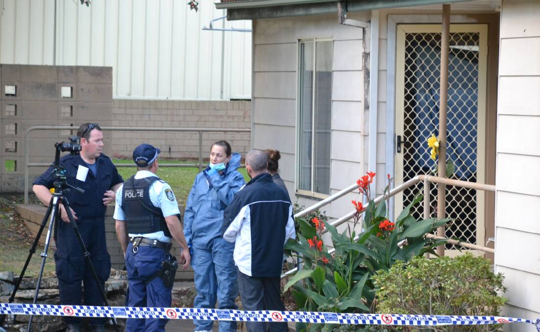 The Douglas Street unit where the man died has been the subject of intense police scrutiny for two days.