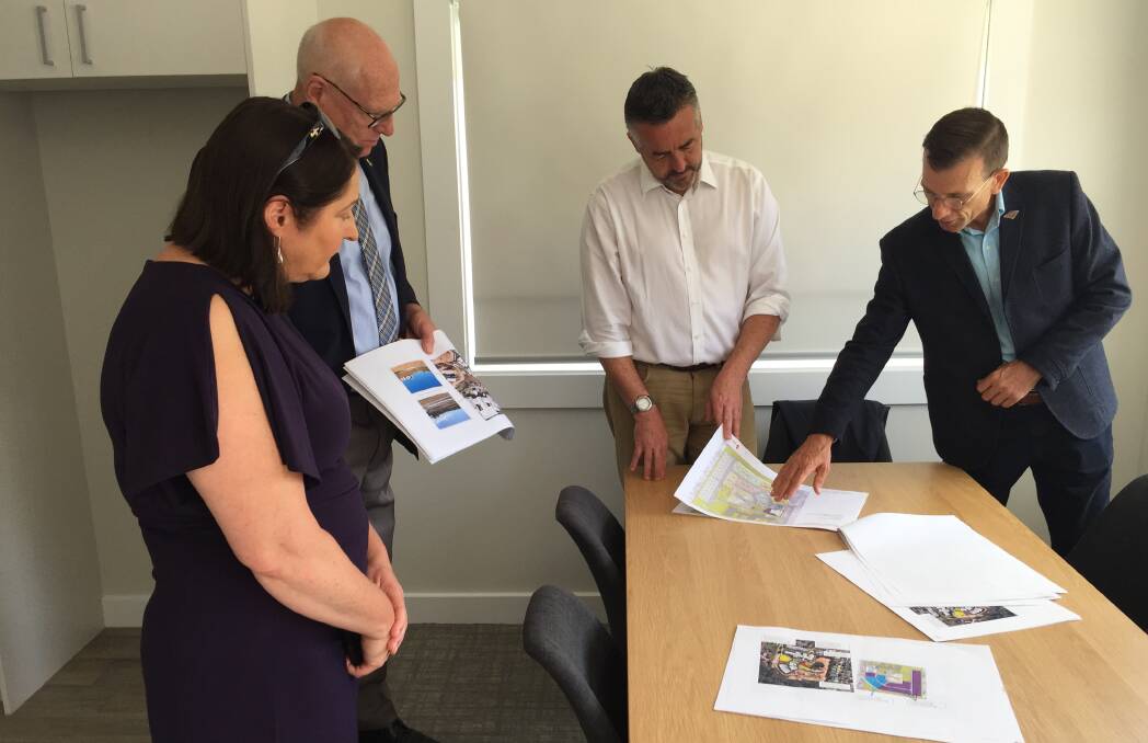 PROJECT: Minister for Veterans Affairs and Defence Personnel Darren Chester (centre), Gilmore MP Fiona Phillips, Senator for NSW Jim Molan and RSL LifeCare chair Andrew Condon look over the plans for the $5 million Nowra Veterans' Wellbeing Centre.