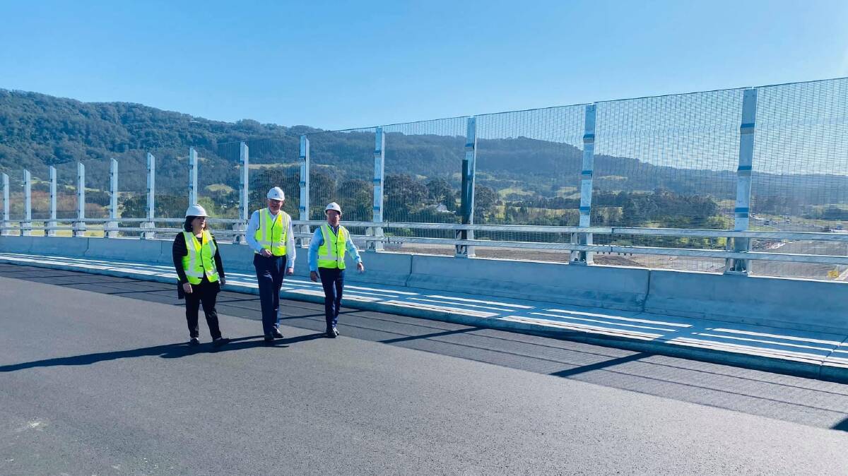 ALMOST READY: South Coast MP Shelley Hancock, Kiama MP Gareth Ward and NSW Minister for Regional Transport and Roads Paul Toole inspect work on the Pestells Lane Bridge which will open to traffic next month.