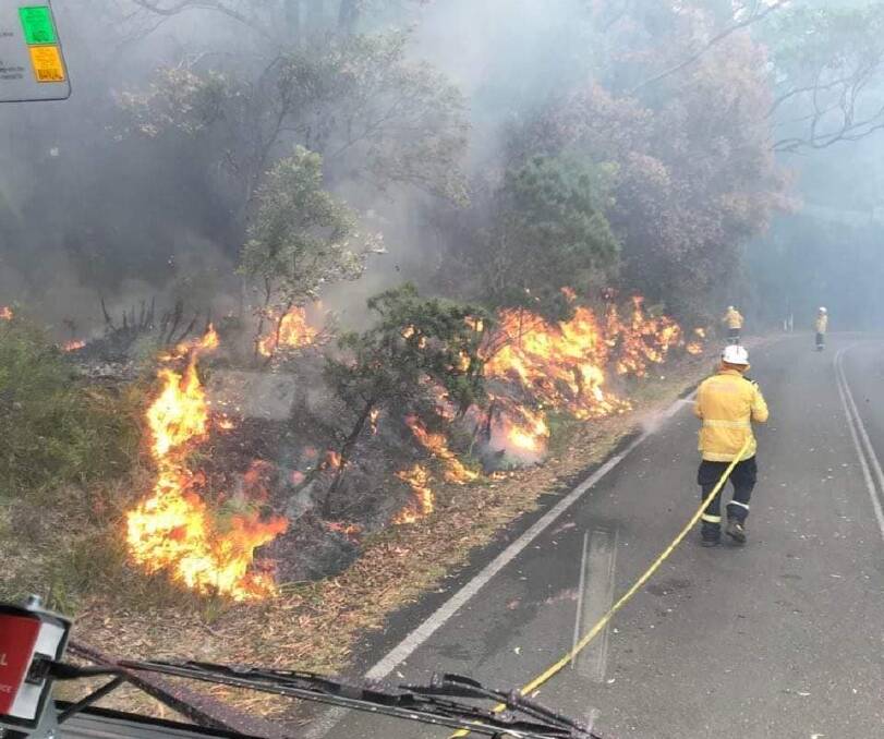 HARD WORK: Gerringong RFS members engaged in the Booderee National Park fire. Image: Gerringong RFS