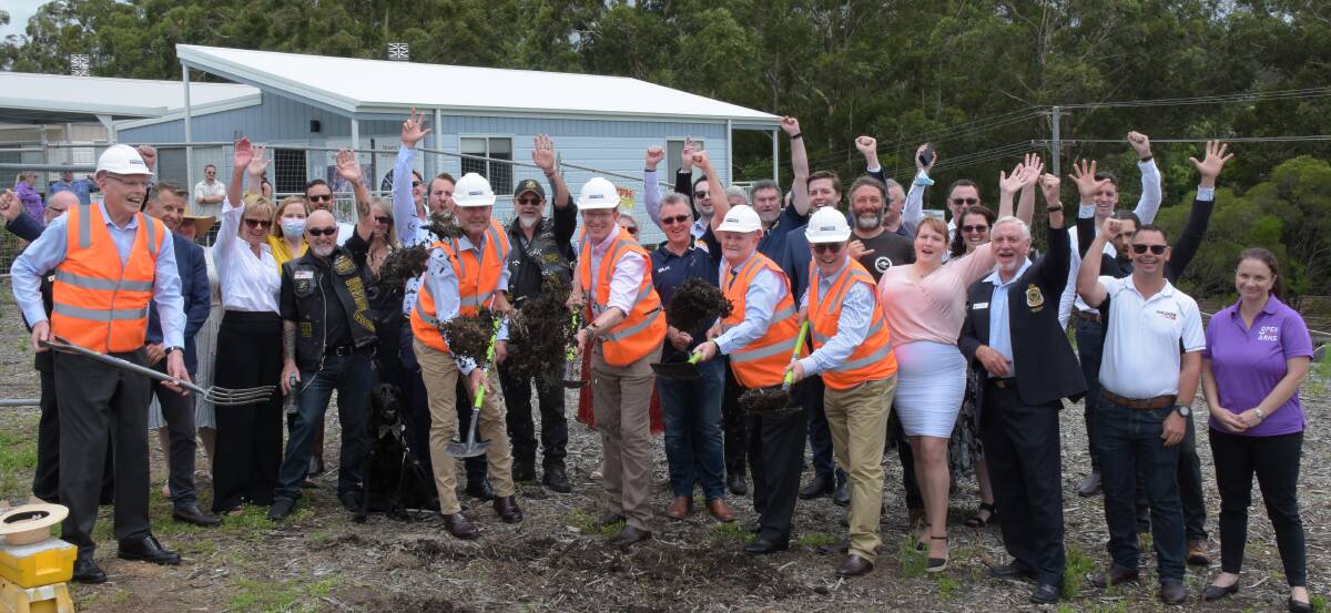 
YOU BEAUTY: Minister for Veterans Affairs and Defence Personnel Andrew Gee (centre front) turns the first sod for the on the Nowra Veterans Wellbeing Centre much to the delight of those assembled.
