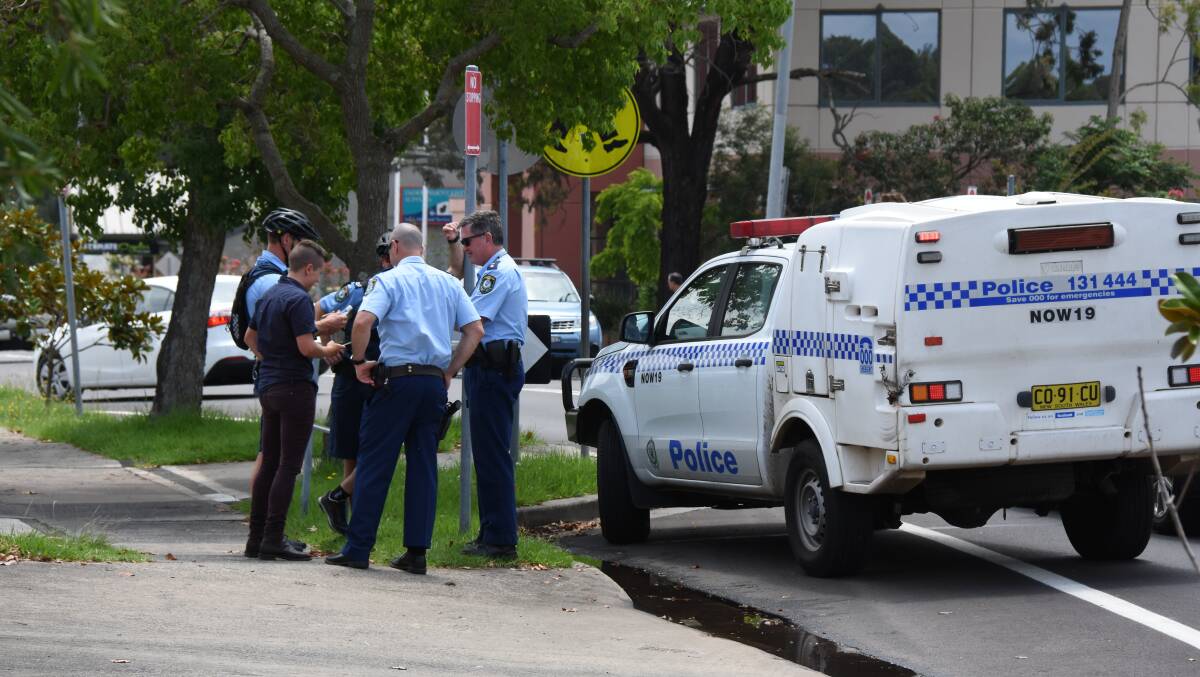 Multiple police arrested a man in O’Keeffe Lane behind the Nowra Mall Shopping Centre on Friday.
