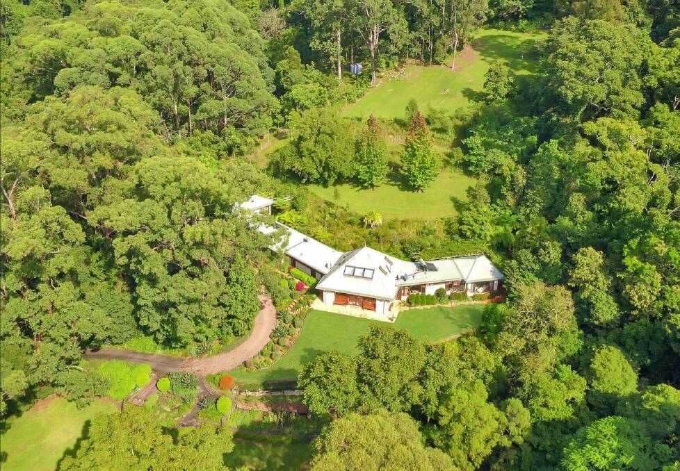 WHAT A LOCATION: Never-Never Land at Broughton Village is a beautiful 10.6 hectare retreat with its own rainforest walk. Image: Supplied