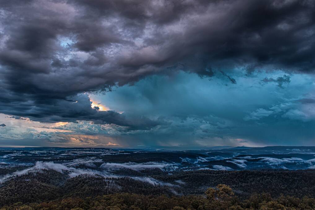 STUNNING: Matt Jeffrey's photo from the Jerrawangala Lookout in the Jerrawangala National Park, overlooking Lake Conjola, as the storm clouds formed.
