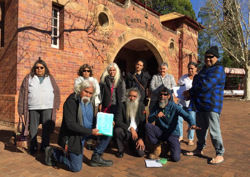 FIGHTING SYSTEM: A number of Jerrinja Aboriginal community members took their protest over the proposed eviction of a number of residents to Nowra Local Court on Wednesday.