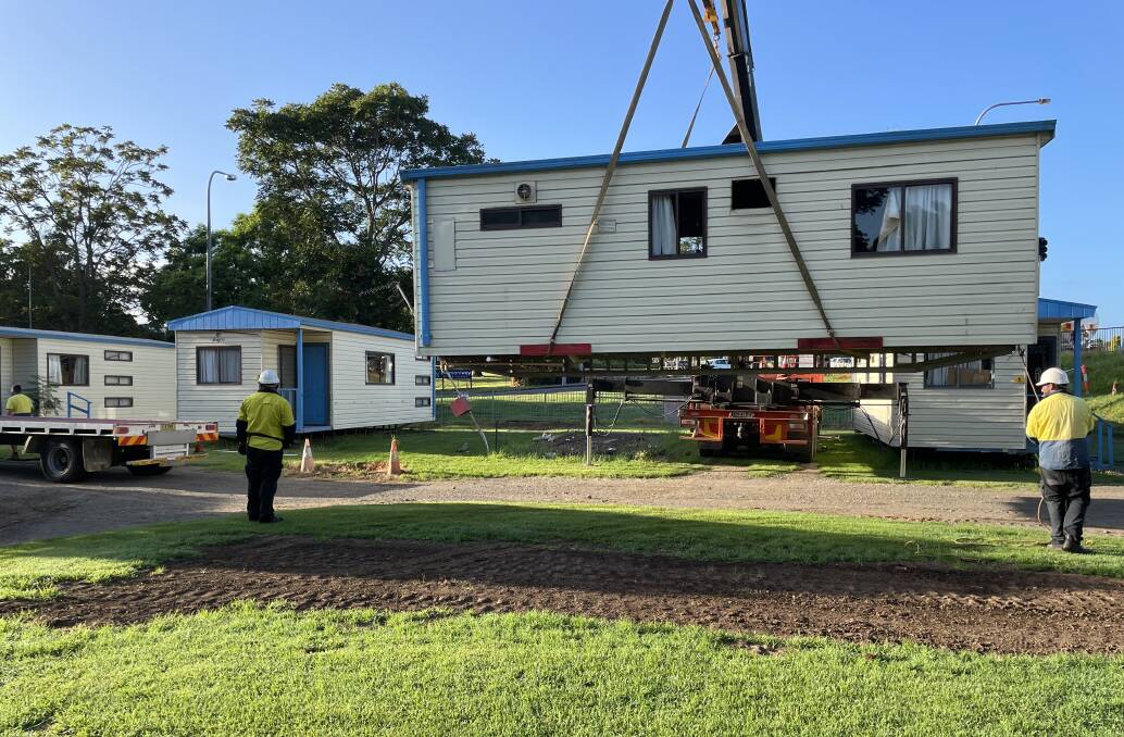 UP, UP AND AWAY: Only six of cabins on the former Gateway Caravan Park site remain with another removed from the property on Wednesday morning.