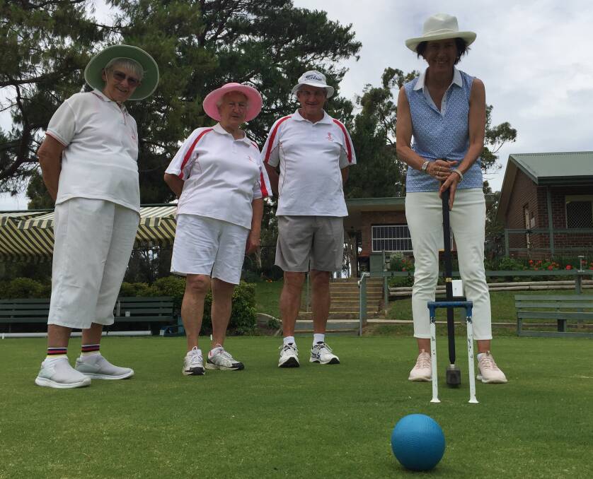 ON THE GREEN: Nowra Croquet Club members (from left) captain Margaret Sawers, Marie McLean and Doug Cornish get the good oil from former world number one player Alison Sharpe.