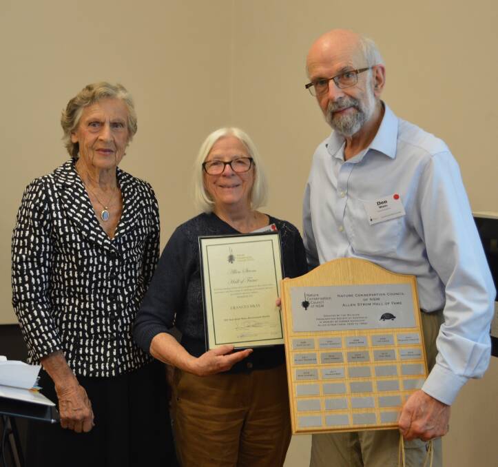 Culburra Beach’s Frances Bray (centre) is presented with the prestigious Alan Strom Hall of Fame Award  by Wendy Bowman and Professor Don White.
