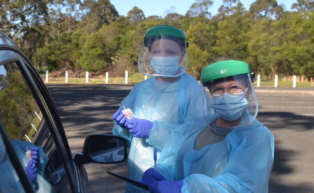 TESTERS: Southern IML Pathology Collectors Kristy Brown and Susanne Cole at the North Nowra pop up drive-through clinic.. Image: Grace Crivellaro.