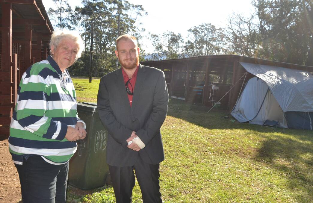VISIT: Shoalhaven Mayor Joanna Gash talks with Alex, just returned from a funeral, who has been living in a tent at the Nowra Showground for three weeks.