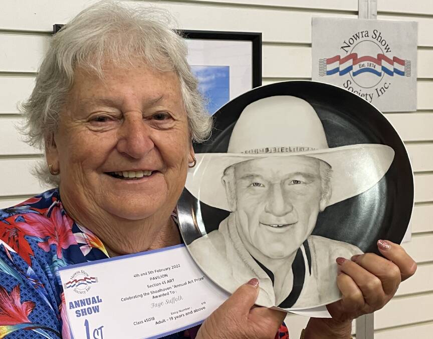 PROUD: Cambewarra porcelain artist Faye Suffolk proudly shows off her Nowra Show Shoalhaven Art Prize winning entry, an unglazed porcelain plate depicting Terry "Buster' Bennett.
