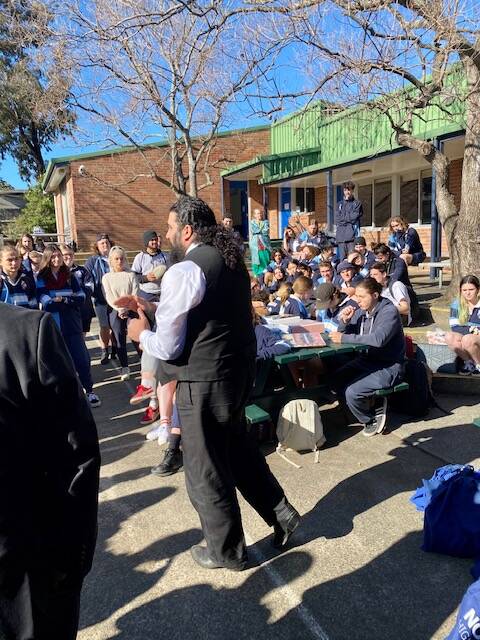 Nowra High School deputy principal Foty Loupos giving words of encouragement to year 12 HSC students and reminding them of where to get help if required.
