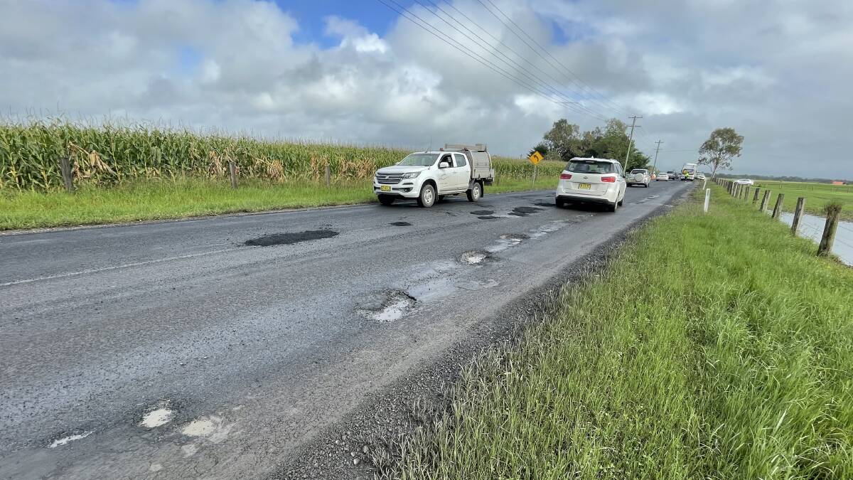BUMPY RIDE: A potholed section of Greenwell Point Road at Brundee.