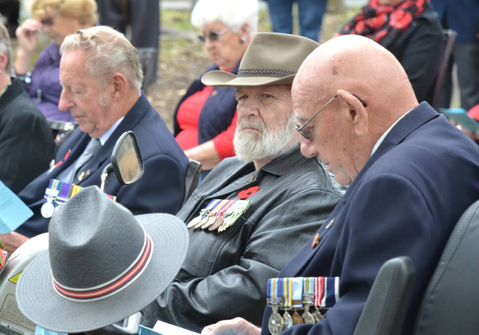 LEST WE FORGET: More than 100 people, including a number of local veterans, gathered at Walsh Park in Bomaderry to mark Remembrance Day 2021.
