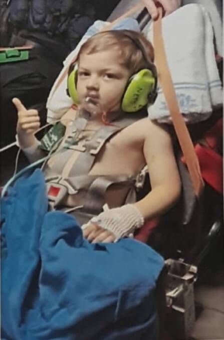 THUMBS UP: Five-year-old Harvey prepares to be airlifted to the Randwick Children's Hospital after being diagnosed with leukemia. Photo: Supplied