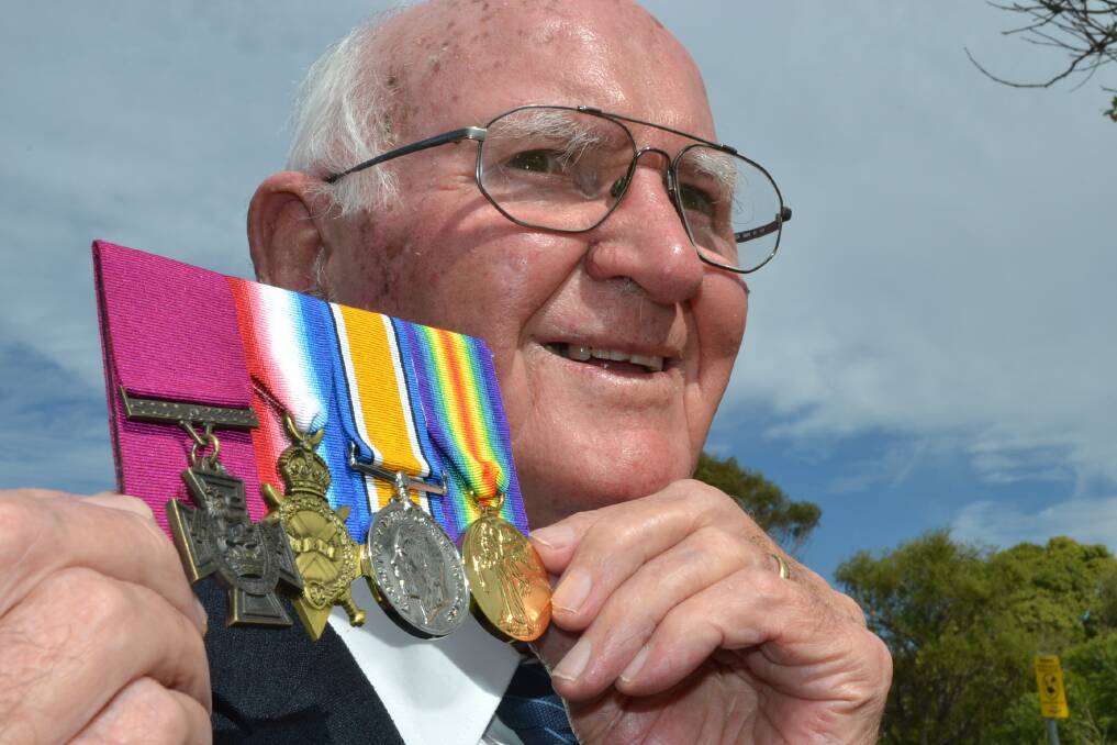 PROUD: The late Brian Kenny proudly shows off his uncle, Bede Kenny's medals including Victoria Cross.