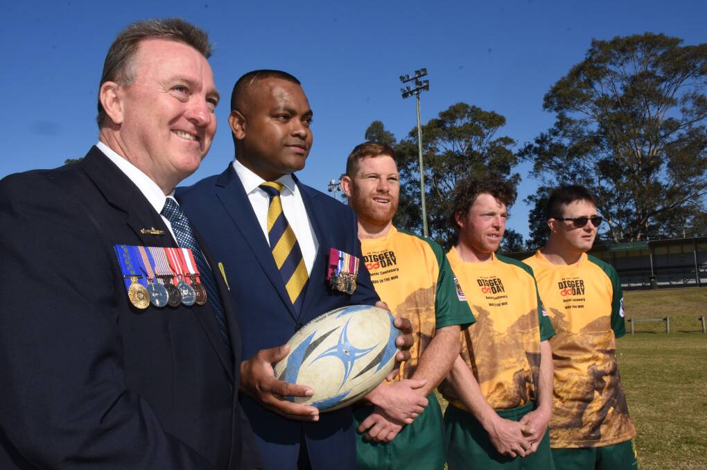 READY TO GO: Shoalhaven Digger Day chairman Rick Meehan with UK Victoria Cross recipient Johnson Beharry, Shoals players Able Seaman aviation technician Clarke Chancellor and Sam Watts and Luke Meehan who will again kick off before Saturday's big match.
