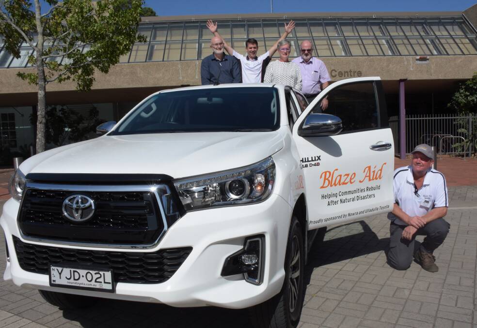 Shoalhaven City Council's Property Manager Trevor Cronk, Nowra Toyota senior salesman Michael Coleman, Shoalhaven Mayor Amanda Findley and council's Economic Development Manager Greg Pullen with BlazeAid Milton co-ordinator Patrick Berkery and the new Toyota vehicle.