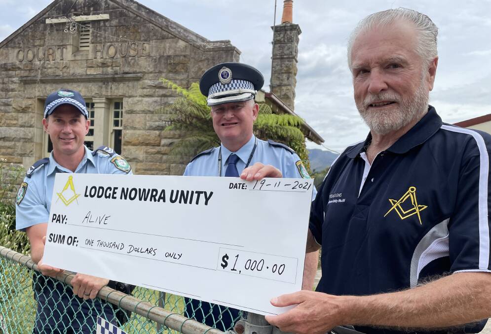 BACKING: Freemasons Lodge Nowra Unity Worshipful Master Mark Baker presents the cheque to Kangaroo Valley cop, Senior Constable Todd Cremer and Officer in Charge of the Nowra Police Station, Inspector Ray Stynes.