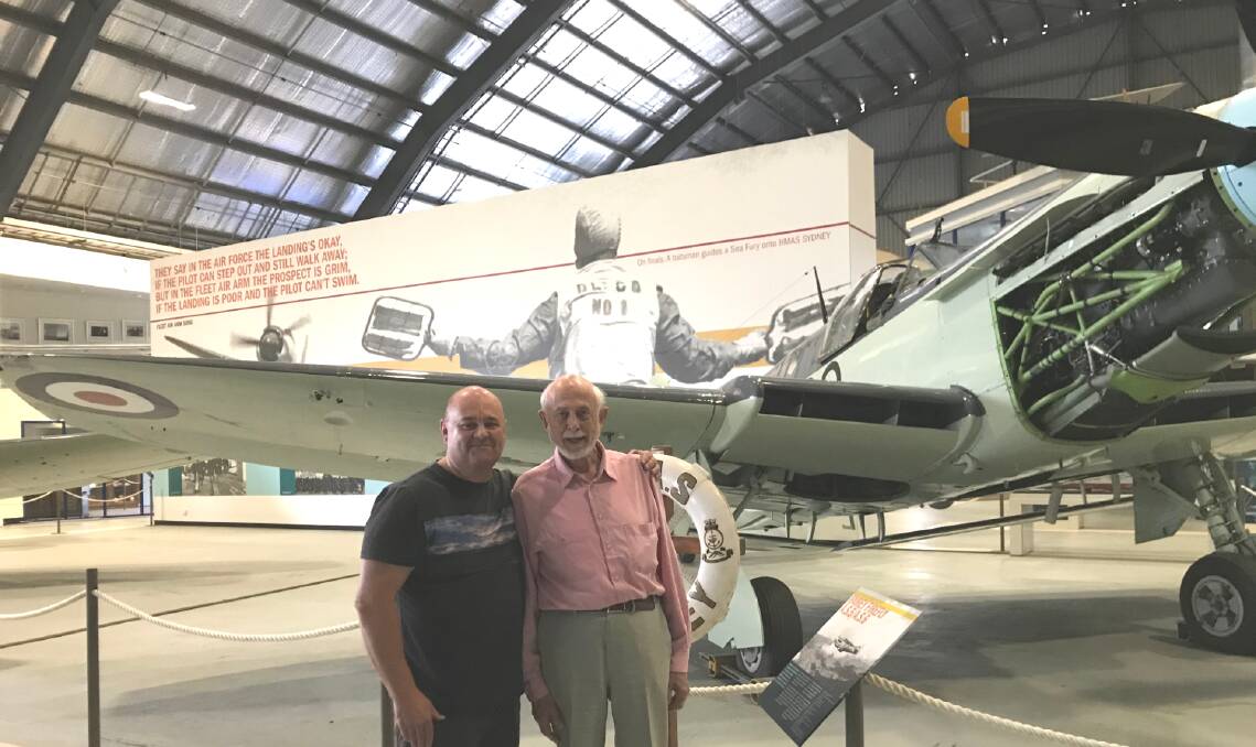 MEMORIES: North Nowra man Greg Stubbs and former Royal Navy pilot David Eagles in front of a Fairey 'Firefly' anti-submarine aircraft at the Fleet Air Arm Museum.
