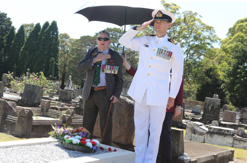 RESPECT: Keith Payne VC and HMAS Albatross' Executive Officer Commander Nigel Rowen pay their respect after laying a wreath at the grave of Private Robert Kearns during Wednesday's service.