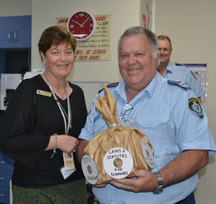 THANKS: South Coast Police District Manager Sue Bucknell presents Senior Constable Anthony Jory with a fun parting gift.