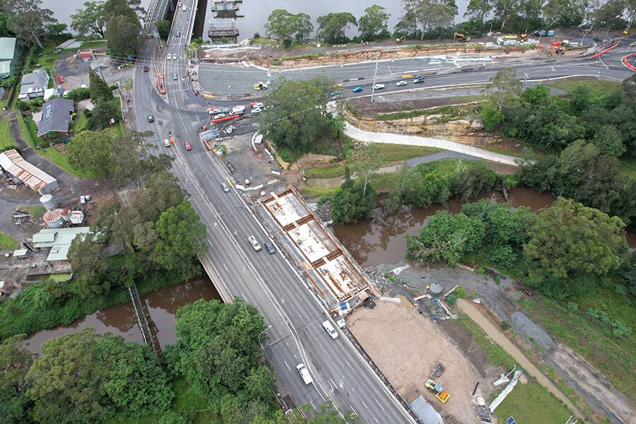 ON TRACK: All 39 bridge planks on the new Bomaderry Creek Bridge have been installed and decks poured, with bridge widening work continuing. Image: Transport for NSW