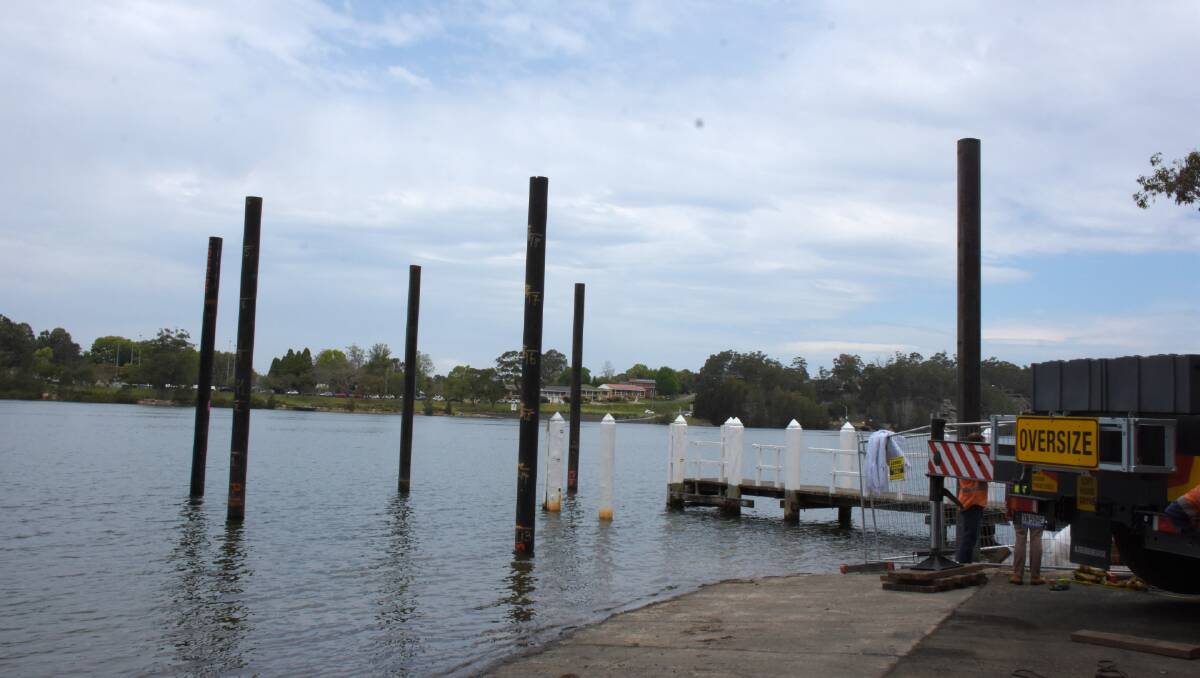 WORK: Crews from Bell Rock Marine from Port Macquarie have installed six pylons into the Shoalhaven River for the new floating jetty at Greys Beach.