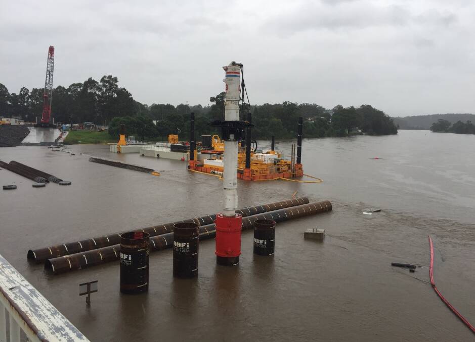 GONE: The construction site of the new Shoalhaven River bridge at Nowra is underwater. The large rock platform, affectionately known by locals as Fulton Hogan Island is completely submerged.