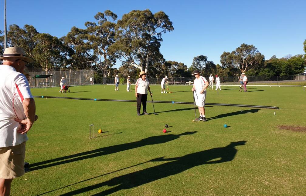 GREAT GATHERING: Nowra Croquet Club members take to the Bomaderry courts for an afternoon game.