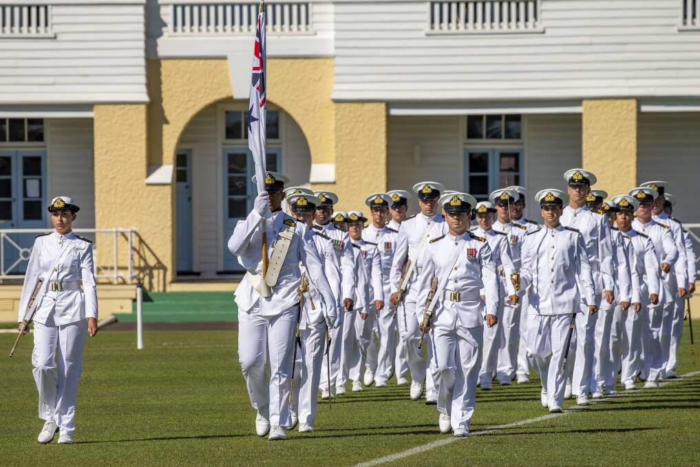 LOOKING SMART: The guard marches onto the parade ground at HMAS Creswell in Jervis Bay during the New Entry Officers Course 63 graduation ceremony. Photo: Cameron Martin