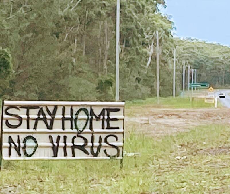 SIGN OF THE TIMES: A sign on Currarong Road, just east of the intersection with Coonamia Road heading towards the seaside village urging holiday makers to stay away,