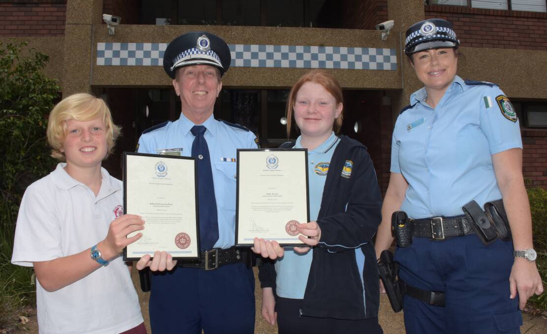 AWARD WINNERS: South Coast Police District Commander Superintendent Greg Moore and Youth Liaison Officer, Senior Constable Kyriana Van den Belt present 2019 Integrity Awards to Callala Public's Ned Grootenboer and Bomaderry's Jolie Davis.
