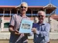 READY: President of the Cambewarra Residents and Ratepayers Association, Graeme Cord (left) with local author Alan Clark and a copy of A History of Cambewarra Cricket which will be launched on Sunday, February 6 at the Cambewarra School of Arts from 3pm..