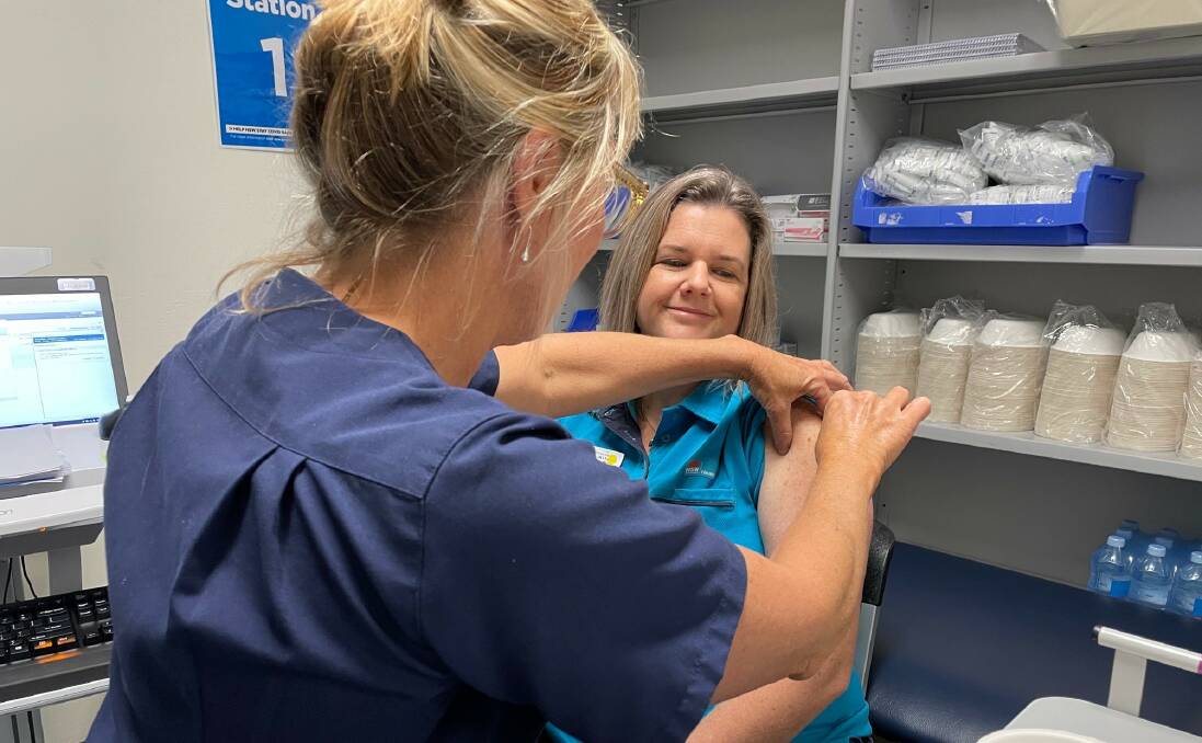 DONE: Intensive Care Unit physiotherapist Kristine Arandale was among the first people to receive the vaccine at Shoalhaven Hospital. Nurse immuniser Mary Oswald administer the "jab". Image supplied