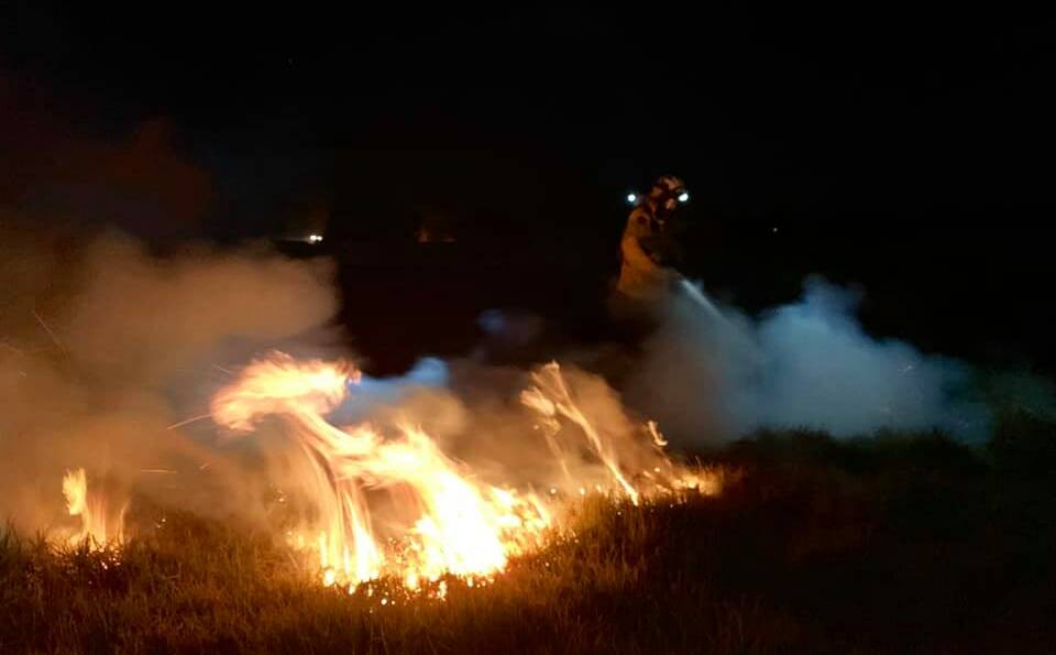 Rural Fire Service crews from Shoalhaven Heads, Greenwell Point, Broughton Vale, Callala Bay and Shoalhaven Deputy Group 1 battled a grass fire on Pig Island in the Shoalhaven River. Photo: Shoalhaven Heads RFS