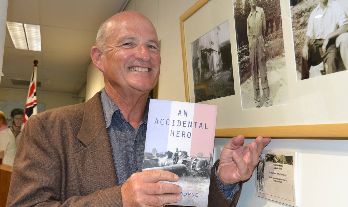 Author Guy Sherborne with his book An Accidental Hero and a photo of his father Fred Sherborne in Chateaurenard in 1944.
